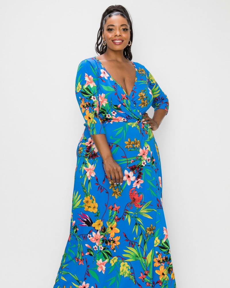 Front of a model wearing a size 1X Erin Floral Wrap Maxi Dress in Blue Floral by L I V D. | dia_product_style_image_id:241520